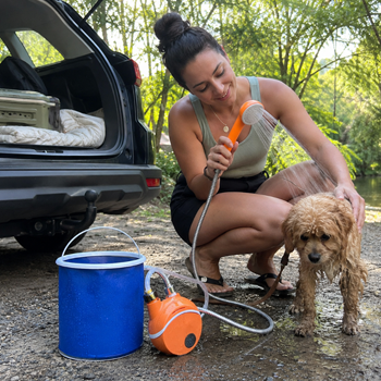 Customer rinsing off with AquaTrail after outdoor activity