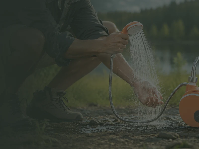 Campsite scene with portable outdoor shower gear