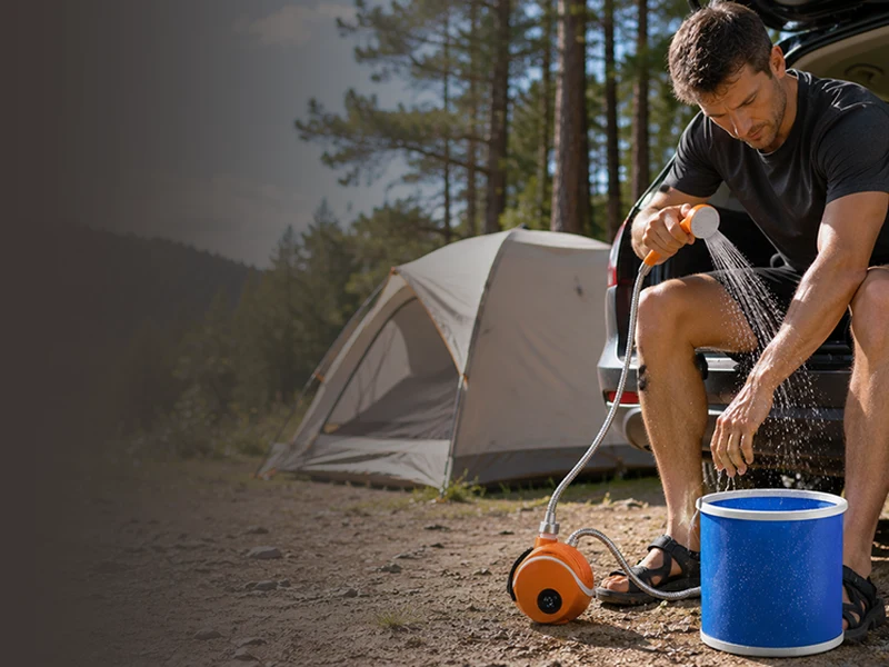 AquaTrail portable shower being used outdoors at a campsite