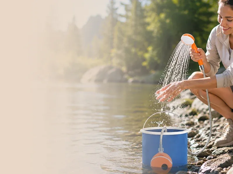 Portable shower being used outdoors